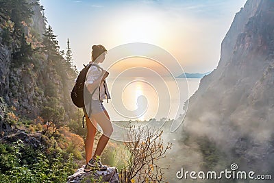 Hiker girl on the mountain top Stock Photo