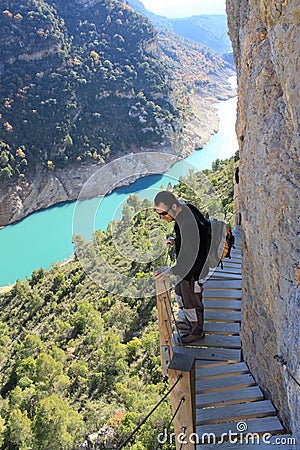 Hiker in the high of the mountain in a footpath Stock Photo