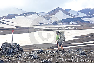 Hiker hikers are walking along the hiking trail of the Icelandic mountains. Landmannalaugar. iceland Editorial Stock Photo