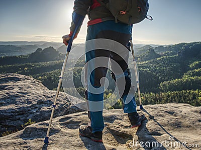 Hiker hold medicine stick, injured knee fixed in knee feature Stock Photo