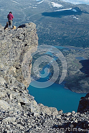 Hiker in Jotunheimen lake and mountains, Norway Stock Photo