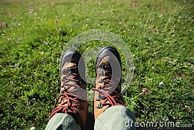 Hiker legs hiking in grassland mountains Stock Photo