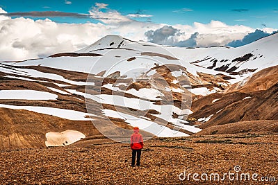 Hiker man standing at Kerlingarfjoll with volcano mountain in summer at Highlands of Iceland Stock Photo