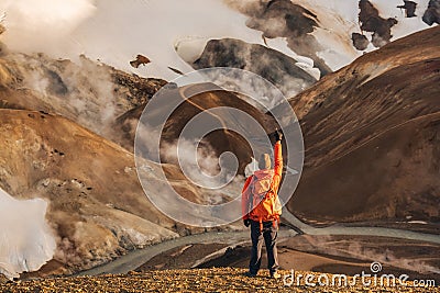 Hiker man standing at Kerlingarfjoll with volcano mountain in summer at Highlands of Iceland Stock Photo