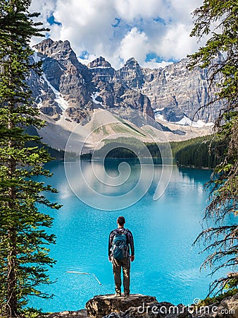 Hiker at Moraine Lake in Banff National Park, Canadian Rockies, Alberta, Canada Stock Photo