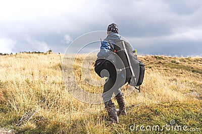 Hiker in the mountains with backpacks Stock Photo