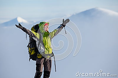 Hiker posing at camera in winter mountains Stock Photo