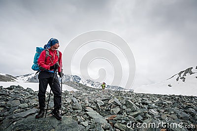 Hiker is posing in mountains Stock Photo