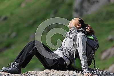 Hiker resting in the mountain Stock Photo