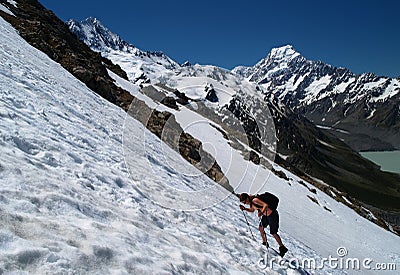 Hiker on snowfield Stock Photo