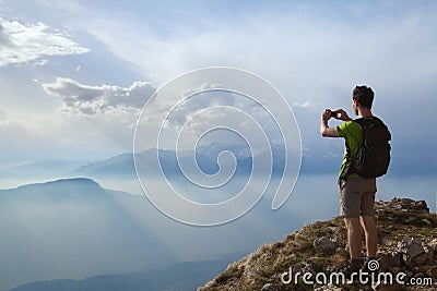 Hiker taking photo Stock Photo