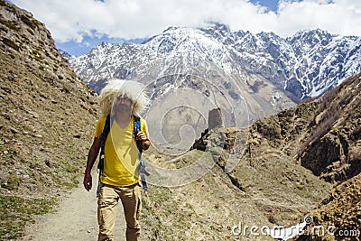 Hiker with traditional papakha fur hat at Mtskheta-Mtianeti region in Georgia Stock Photo