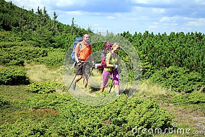 Hiker trekking in the mountains. Stock Photo