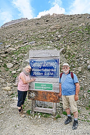 Hiker walking along a path at Grossglockner Mountain and Pasterz Editorial Stock Photo