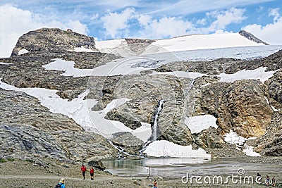 Hiker walking along a path at Grossglockner Mountain and Pasterz Editorial Stock Photo