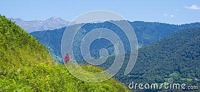 Hiker walking through the Cirque de Lescun, Pyrenees Editorial Stock Photo