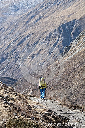 Hiker walking on the trail in Nepal, on Annapurna Circuit Stock Photo