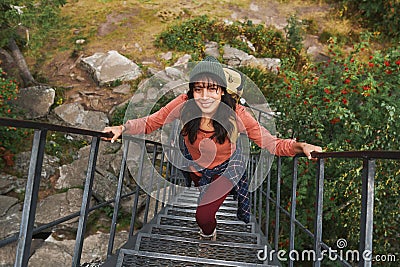 Hiker walking up steps Stock Photo