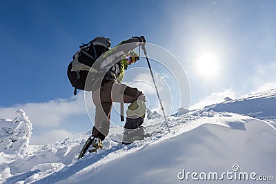 Hiker walking in winter Carpathian mountains Stock Photo