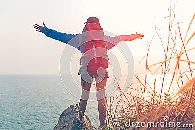 Hiker woman happy feeling freedom good and strong weight victorious facing on the natural mountain, Stock Photo
