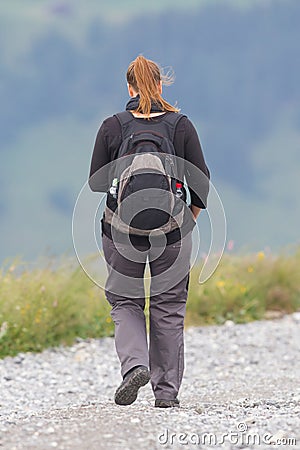 Hiker, young woman with backpack Stock Photo