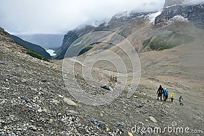 Hikers on the alpine trail in the Canadian Rockies along the Icefields Parkway between Banff and Jasper Editorial Stock Photo