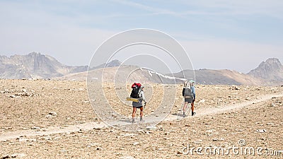 Hikers heading to Forester Pass Mountain Landscapes in the Sierra Nevada Range of California on the Pacific Crest Trail. Stock Photo