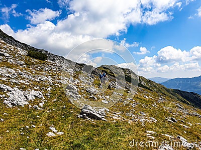 Hikers on Iorgovanu Stone, Romania Stock Photo