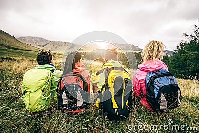 Hikers looking at sunset Stock Photo