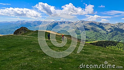 Hikers on Oslea Ridge, Valcan Mountains, Romania Stock Photo
