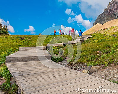 Hikers on the Plank Trail Glacier National Park Editorial Stock Photo