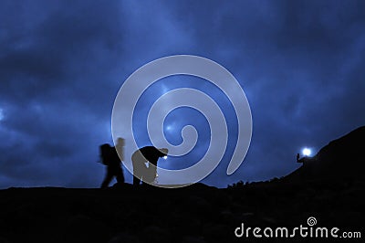 Hikers prepare to ascend Scafell Pike at night Stock Photo