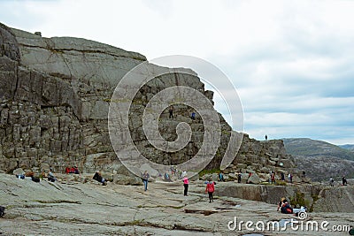 Hikers resting atop the Pulpit Rock Editorial Stock Photo
