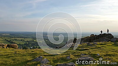 Hikers on the summit of Sheepstor. Dartmoor National Park, Devon Uk Stock Photo