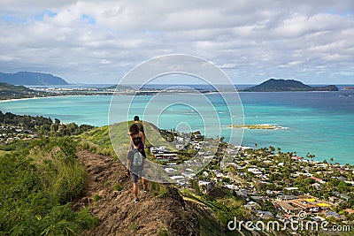 Hikers with the view of Lanikai from a top the Pillbox hiking tr Stock Photo