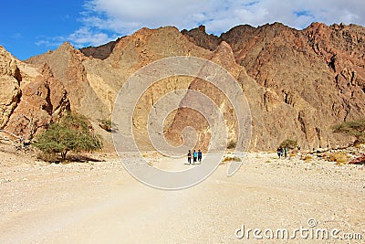 Hikers walk in the desert Editorial Stock Photo