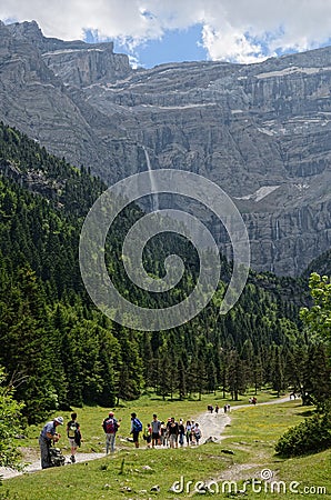 Hikers walking to the cirque of Gavarnie Editorial Stock Photo