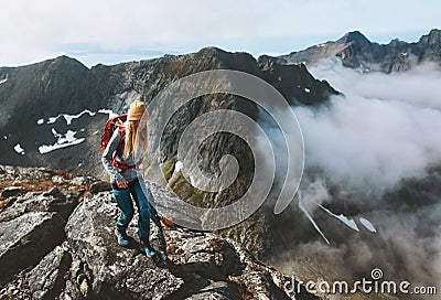 Hiking adventures woman trail running in mountains with backpack solo travel outdoor Stock Photo