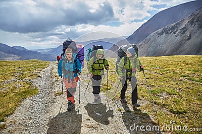 Hiking in the Altai mountains, amazing landscape of the valley of the mountain range. Group hiking, multi-day backpacking. Russia Editorial Stock Photo