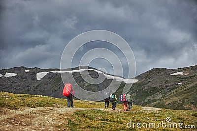 Hiking in the Altai mountains, amazing landscape of the valley of the mountain range. Group hiking, multi-day backpacking. Russia Editorial Stock Photo