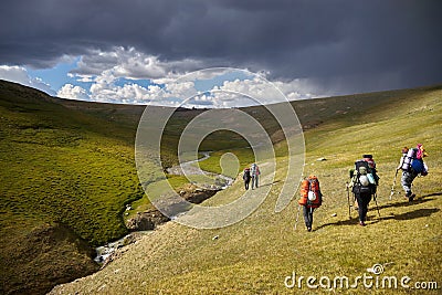 Hiking in the Altai mountains, amazing landscape of the valley of the mountain range. Group hiking, multi-day backpacking. Russia Editorial Stock Photo