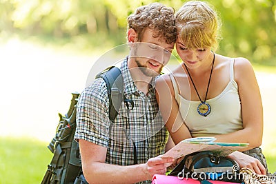 Hiking backpacking couple reading map on trip. Stock Photo