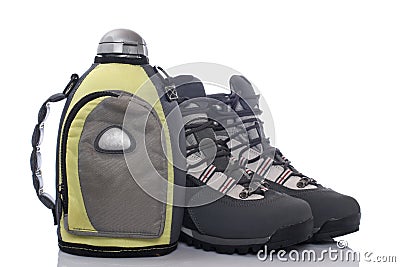 Hiking boots and canteen Stock Photo