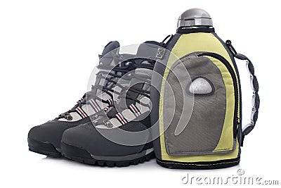 Hiking boots and canteen Stock Photo