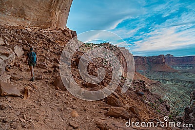 Hiking Canyonlands Backpacker on the trail to False Kiva Stock Photo