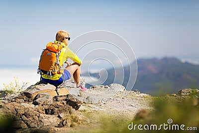 Hiking happy woman relaxing in mountains Stock Photo