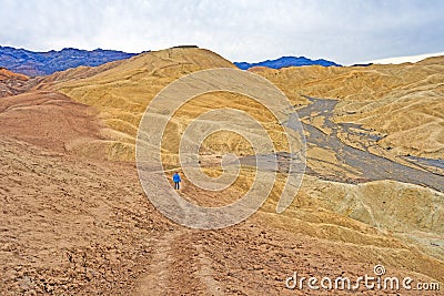 Hiking into a Lonely Desert Valley Stock Photo