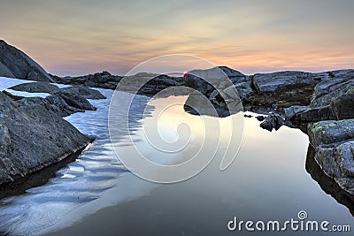 midnight sun and small glaciers Stock Photo