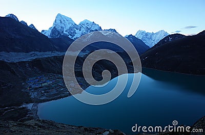 Hiking in Nepal Himalayas, View of Gokyo village, Gokyo lake, Ngozumba glacier, Arakam Tse and Cholatse mountain Stock Photo