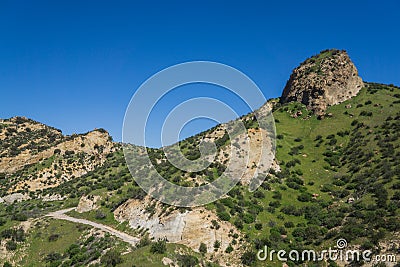 Hiking Path Beneath Rock Butte Stock Photo